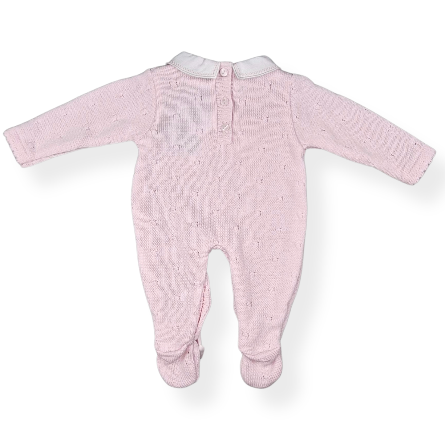 Pink baby onesie with white star pattern on a white background