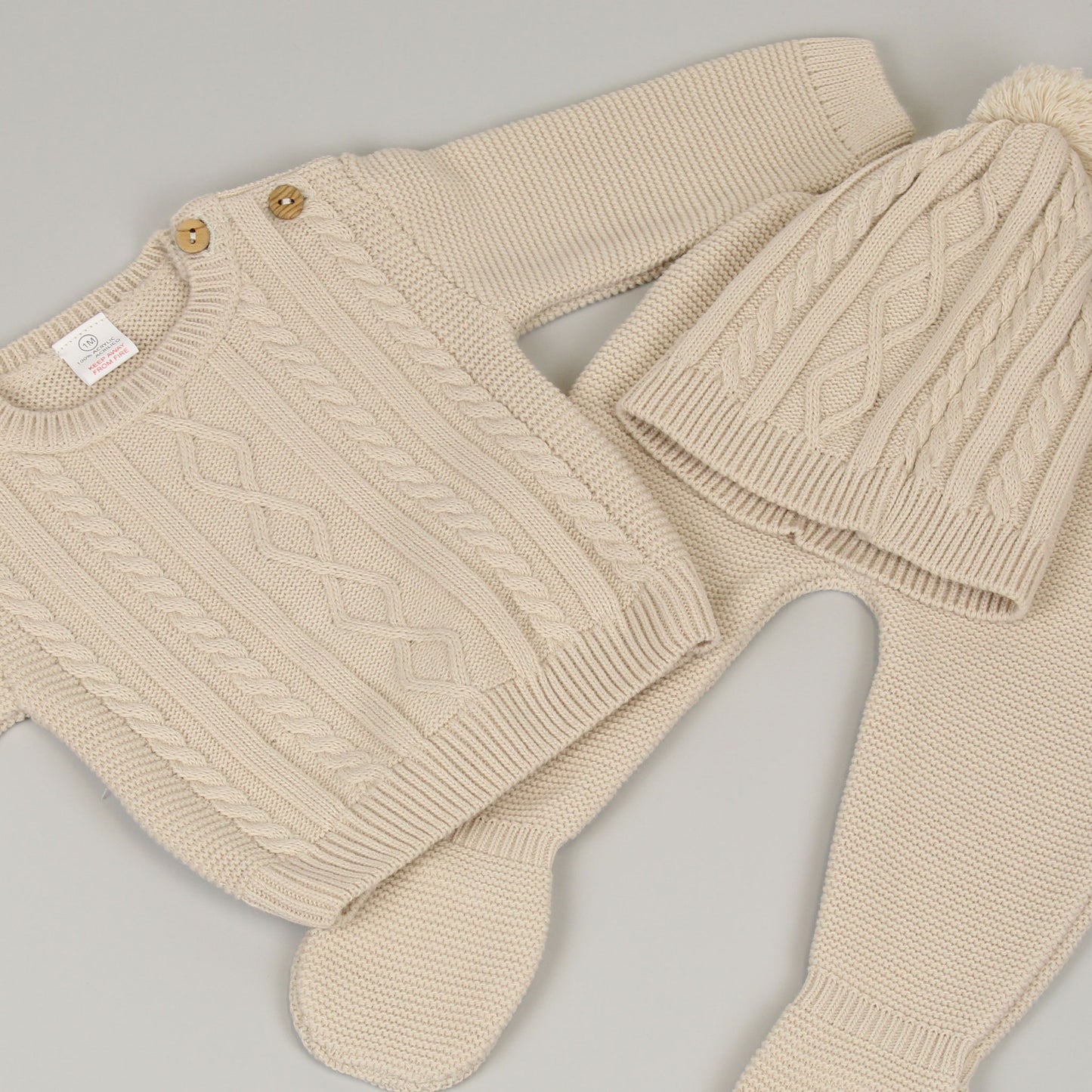 three piece beige knitted outfit baby unisex