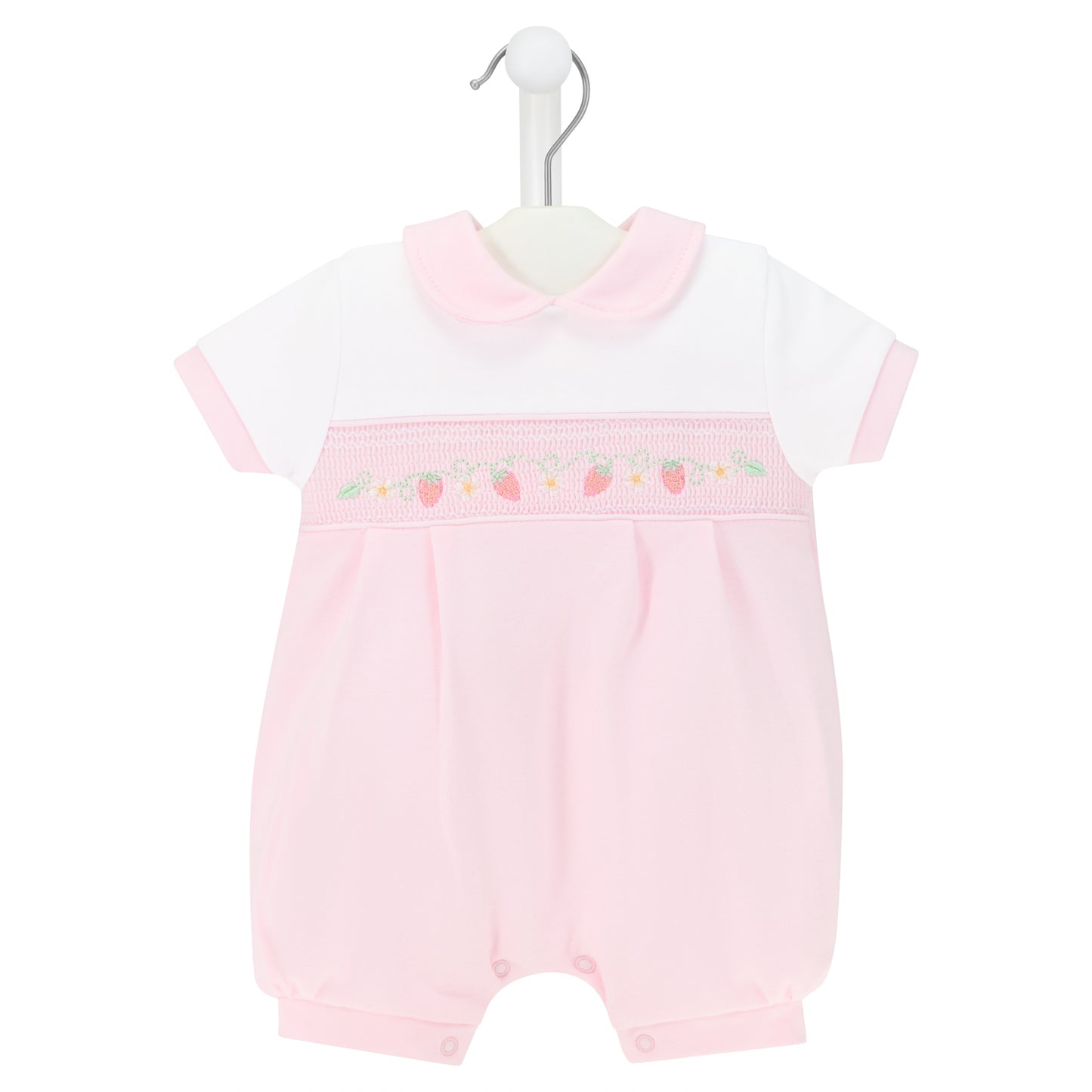 Pink baby romper with white top on a hanger against a white background
