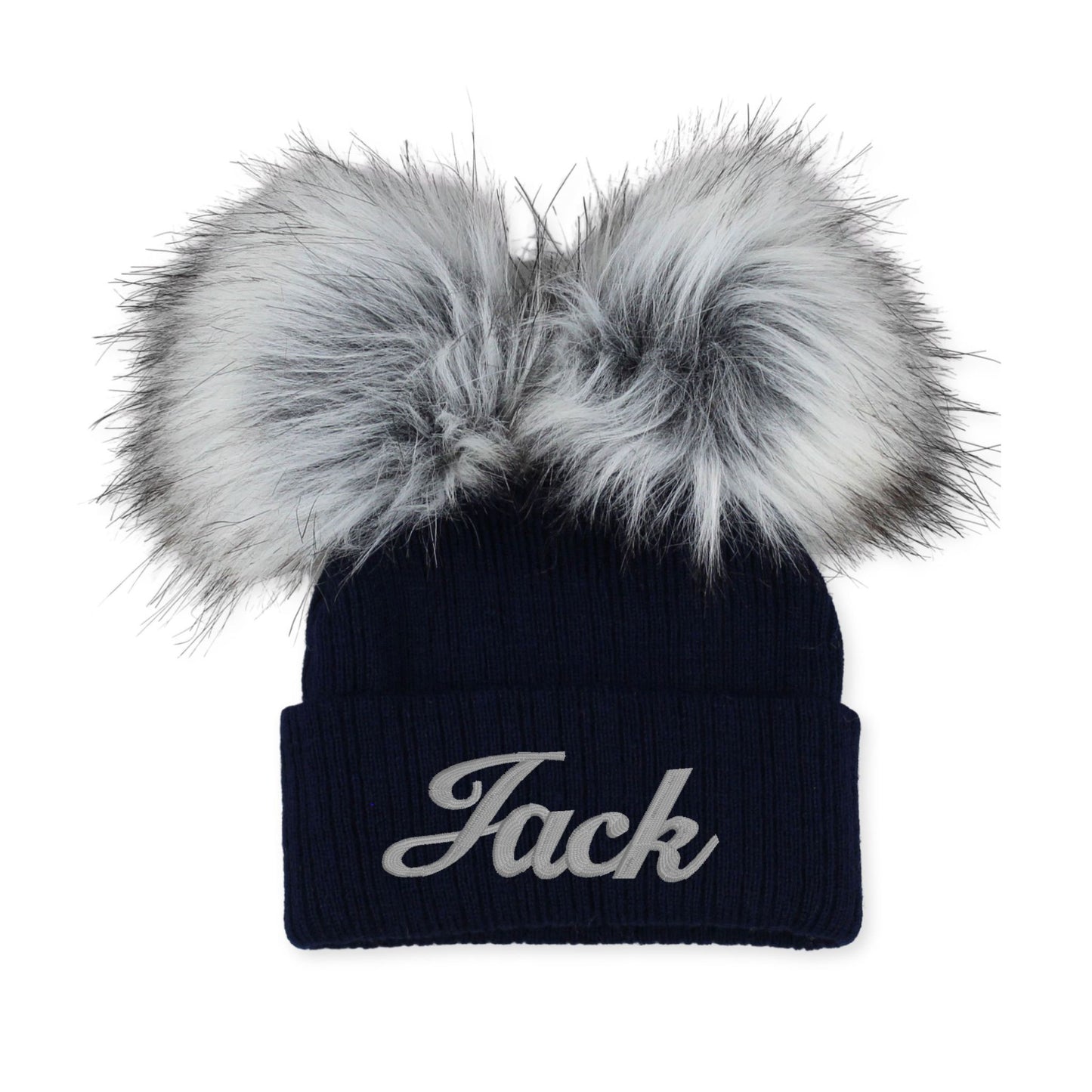 Navy beanie with 'Jack' embroidery and large faux fur pom-poms on a white background