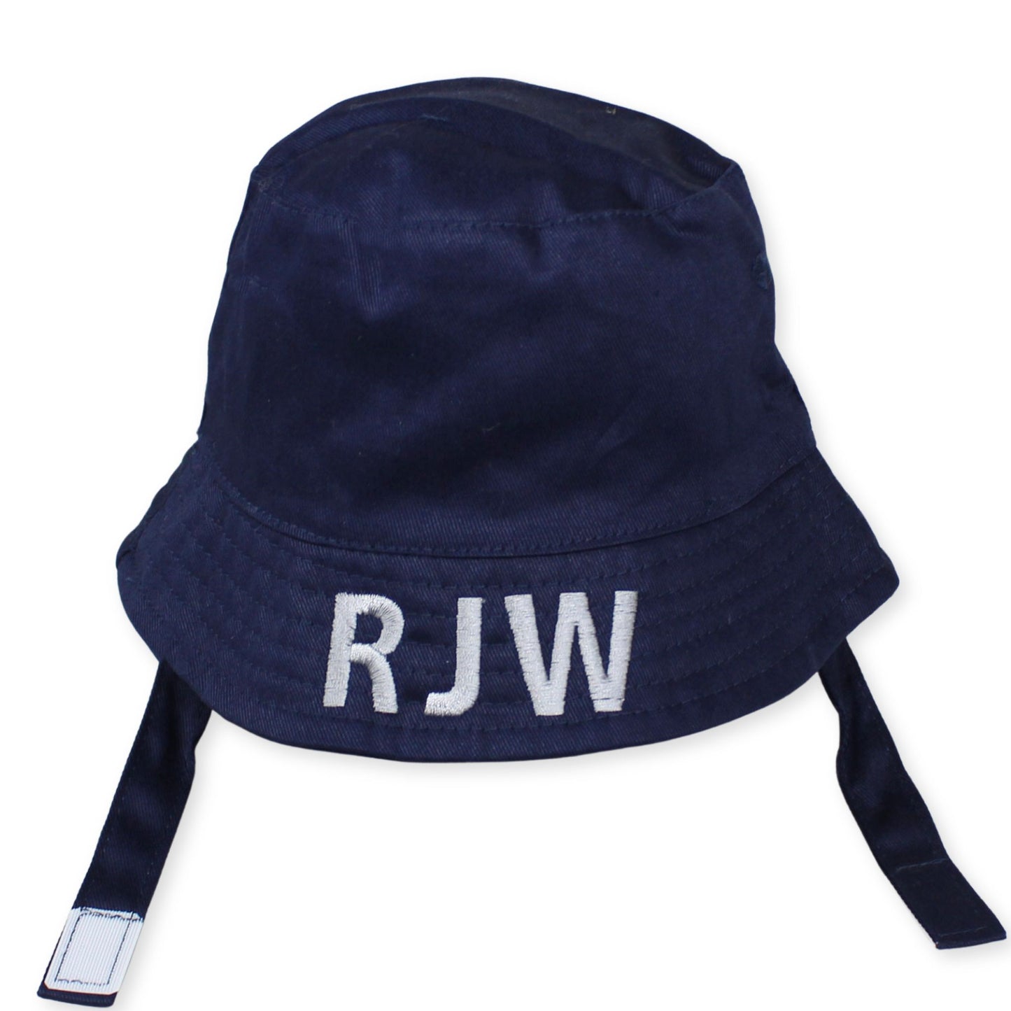 Navy blue baby boy's bucket hat with chin straps and white embroidery threads with the initial 'RJW' on the front.