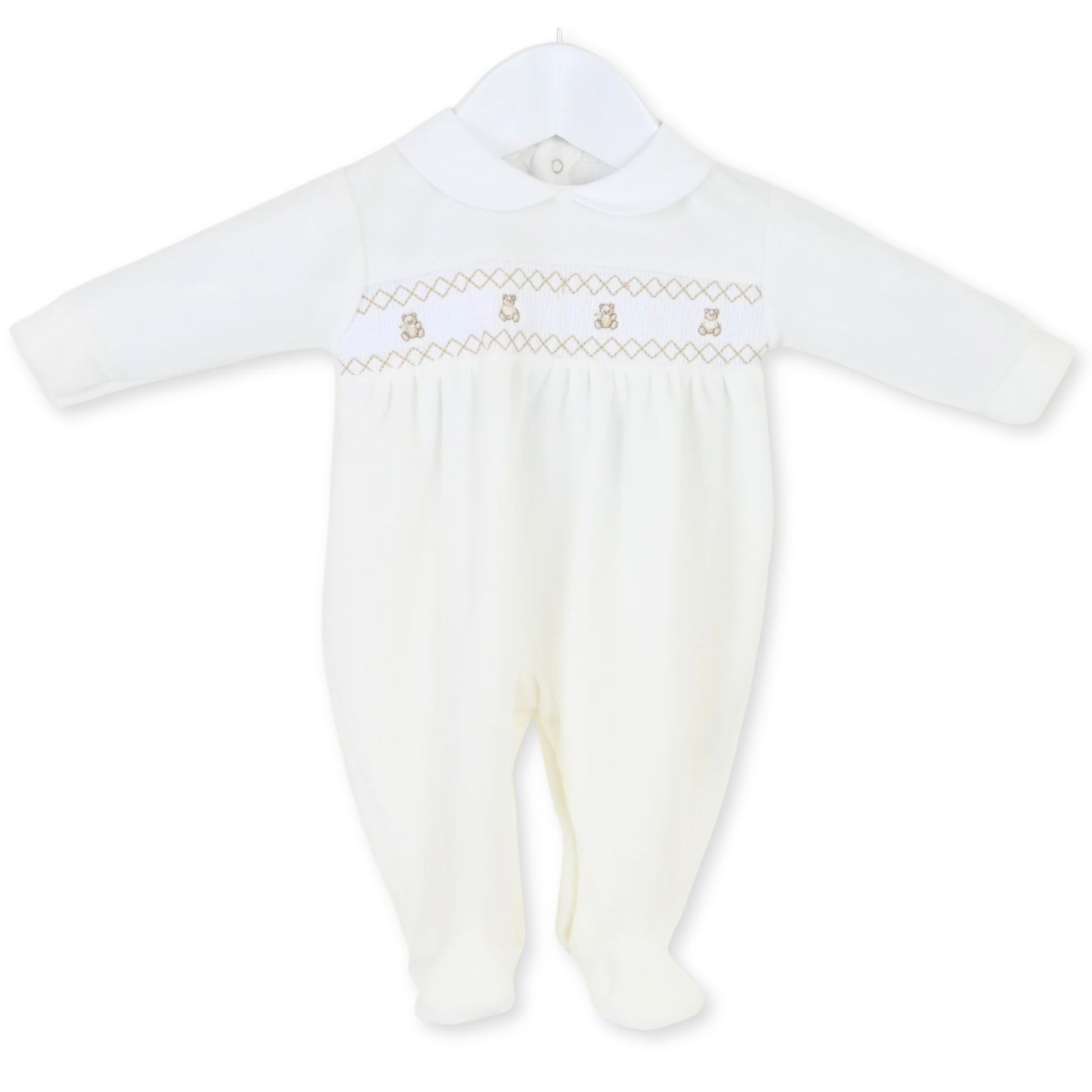 white smocking babys sleepsuit