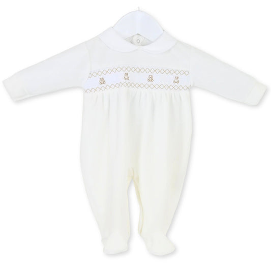 white smocking babys sleepsuit