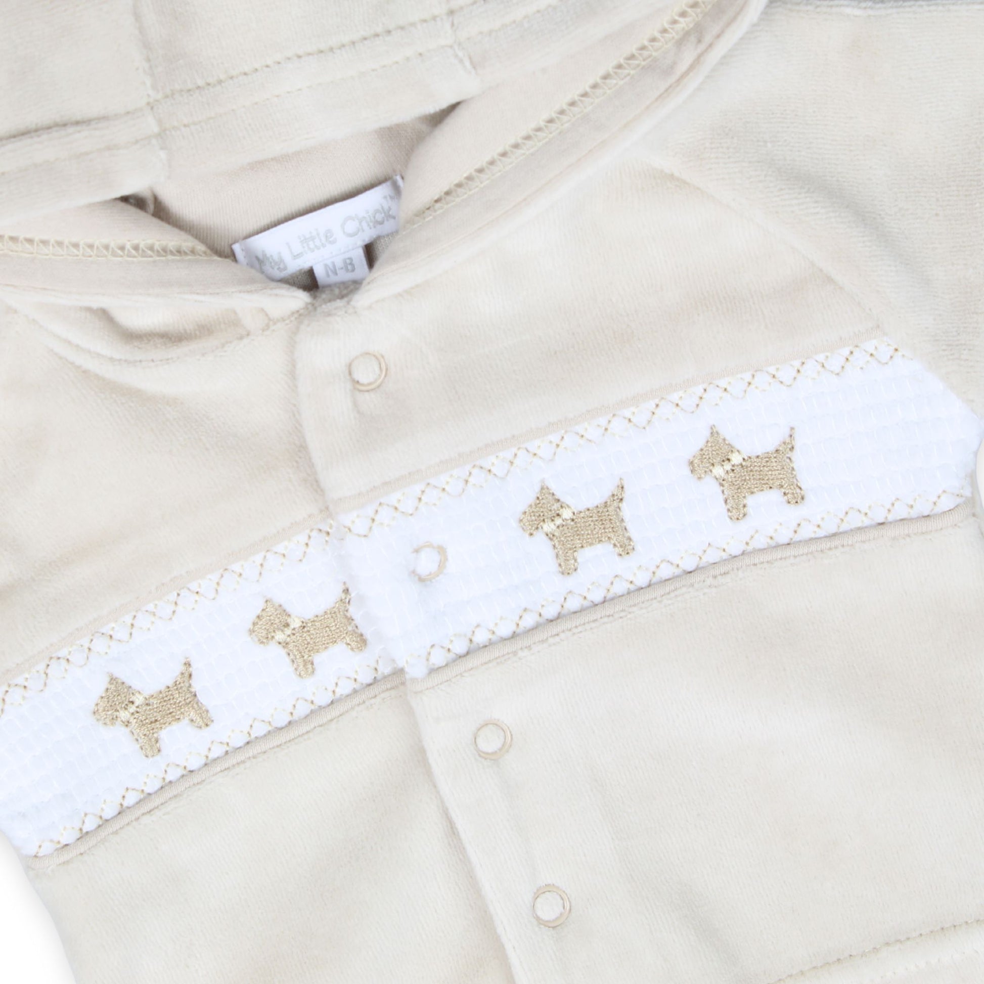 unisex beige three piece outfit with embroidered dogs