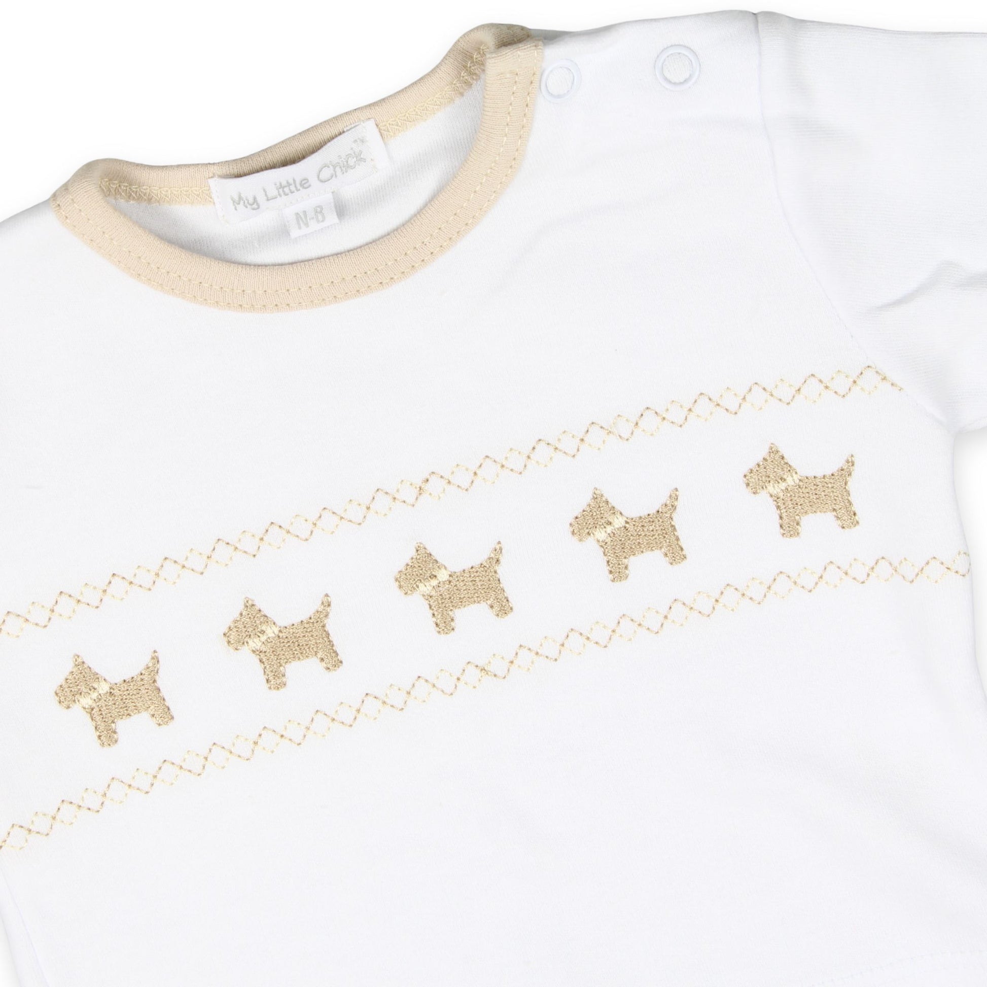 unisex beige three piece outfit with embroidered dogs