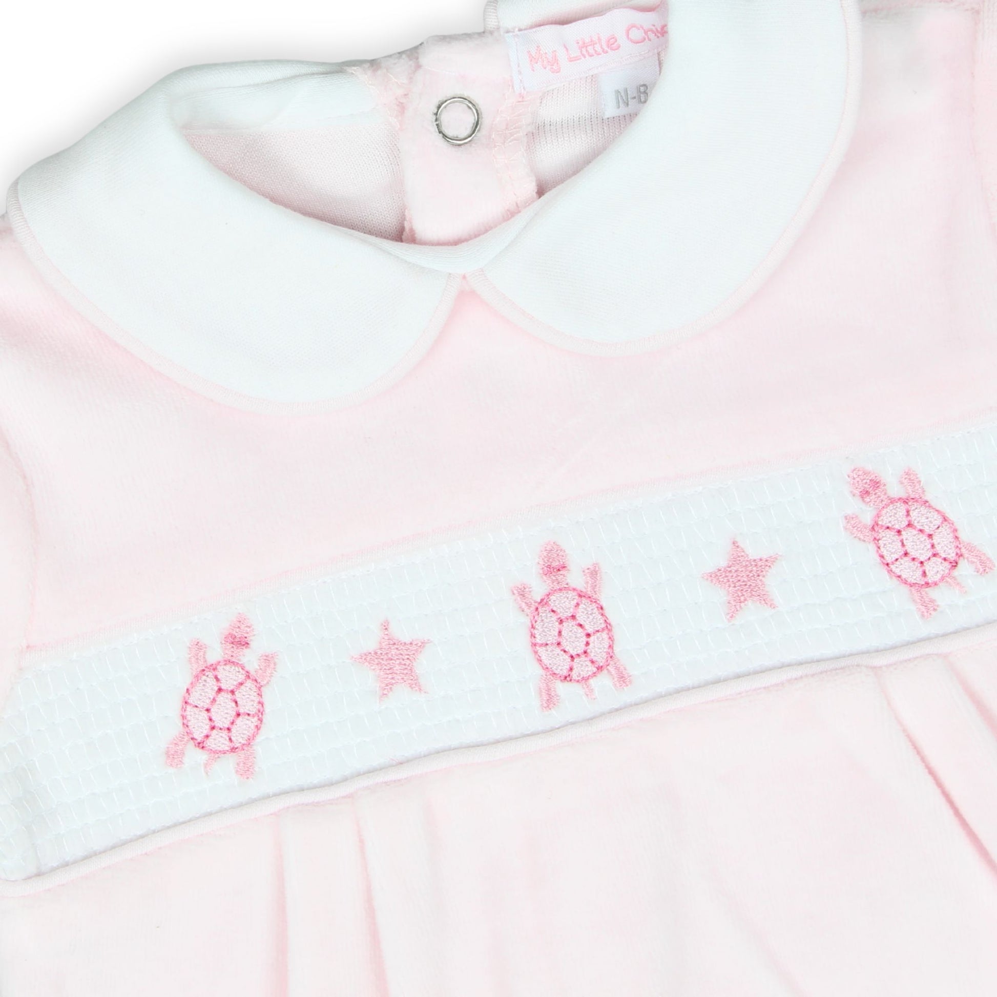 baby girls pink velour sleepsuit with embroidered tortoise smocking