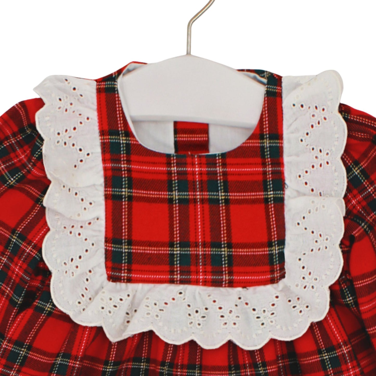 Red plaid dress with white lace collar on a hanger