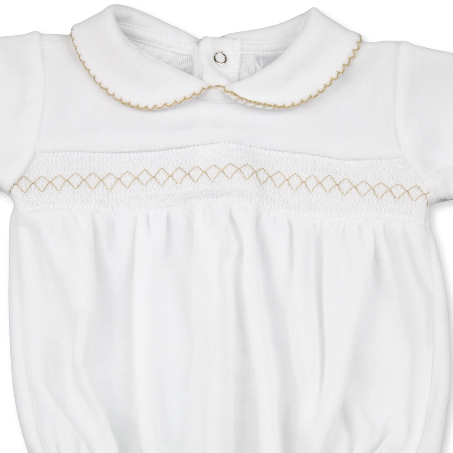 White baby outfit with gold embroidery on a white background