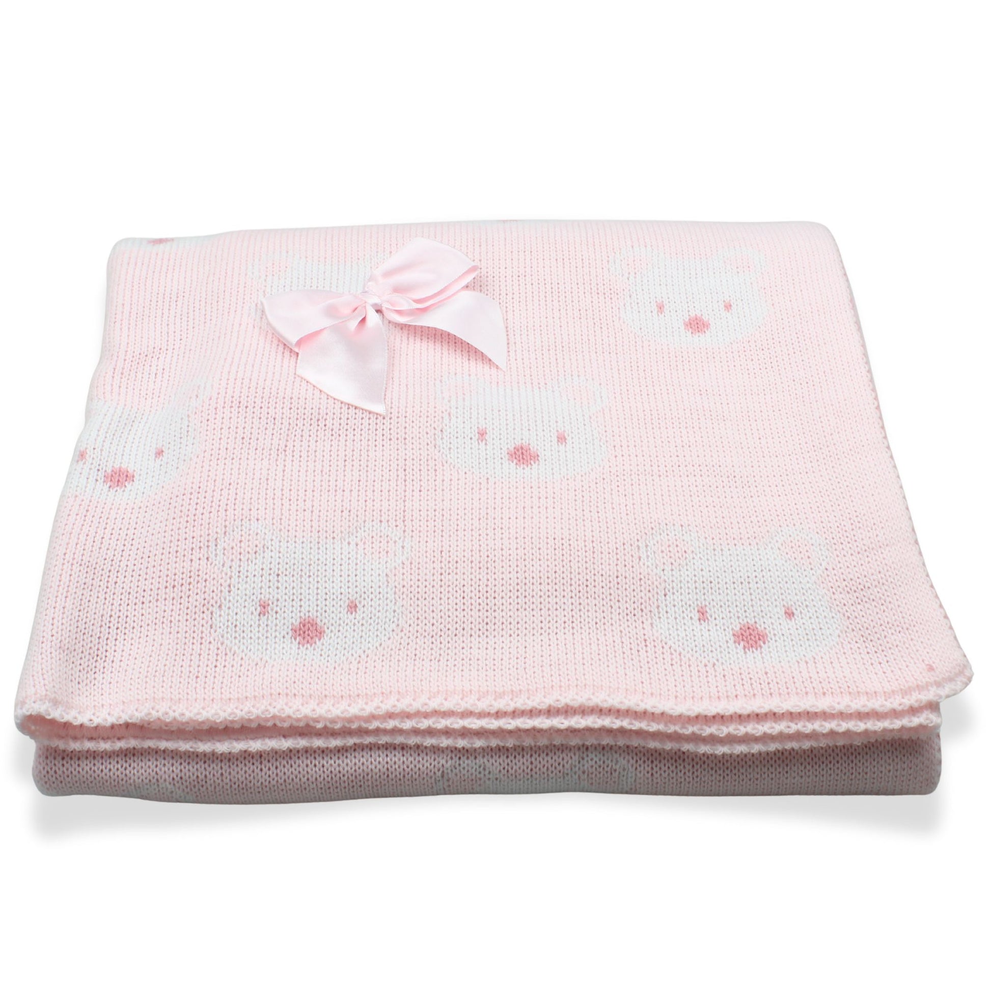 Pink baby blanket with bow and bear patterns on a white background