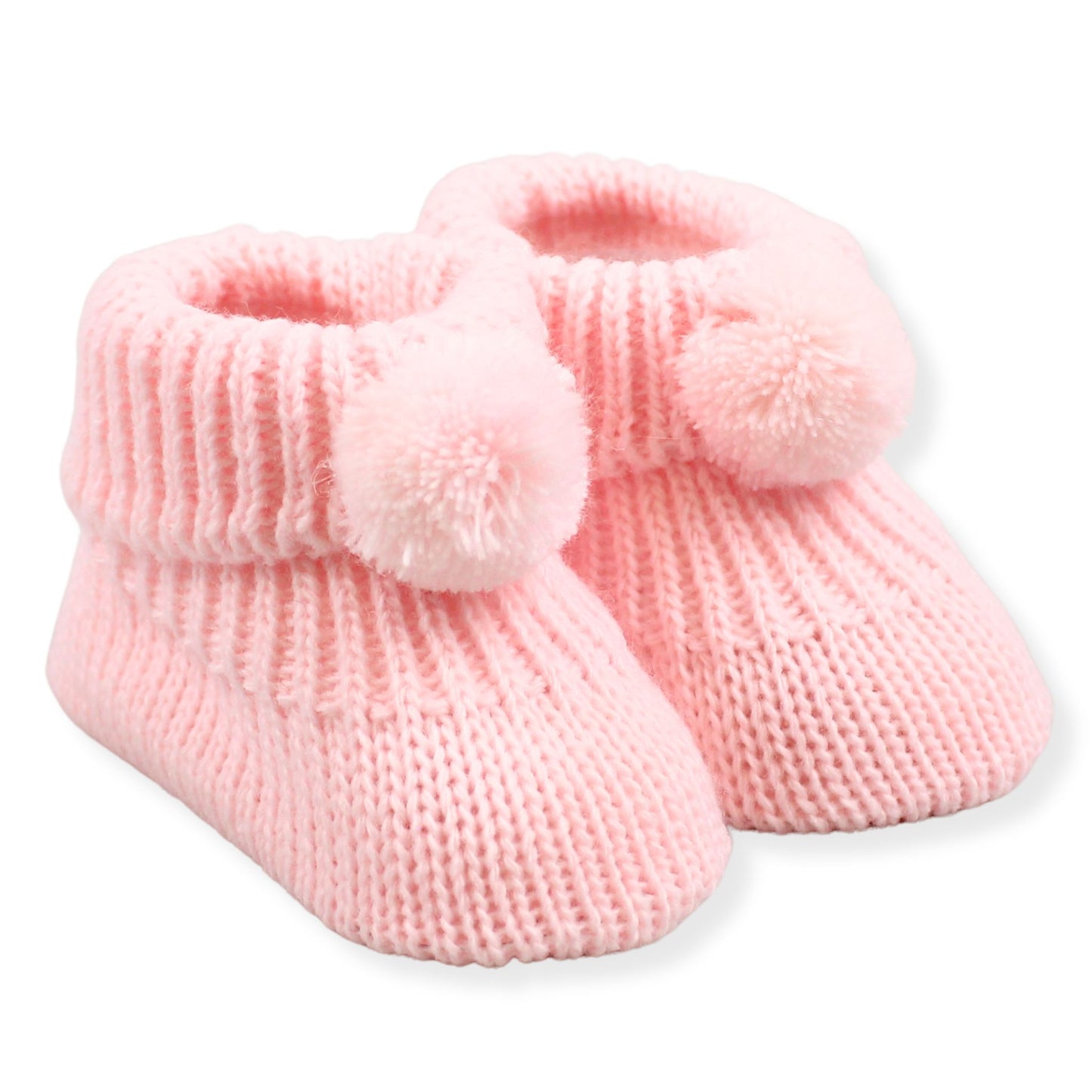 Pair of pink knitted baby booties with pom-poms on a white background