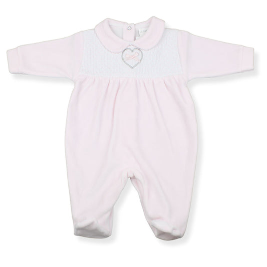 Pink baby onesie with a heart design on a white background