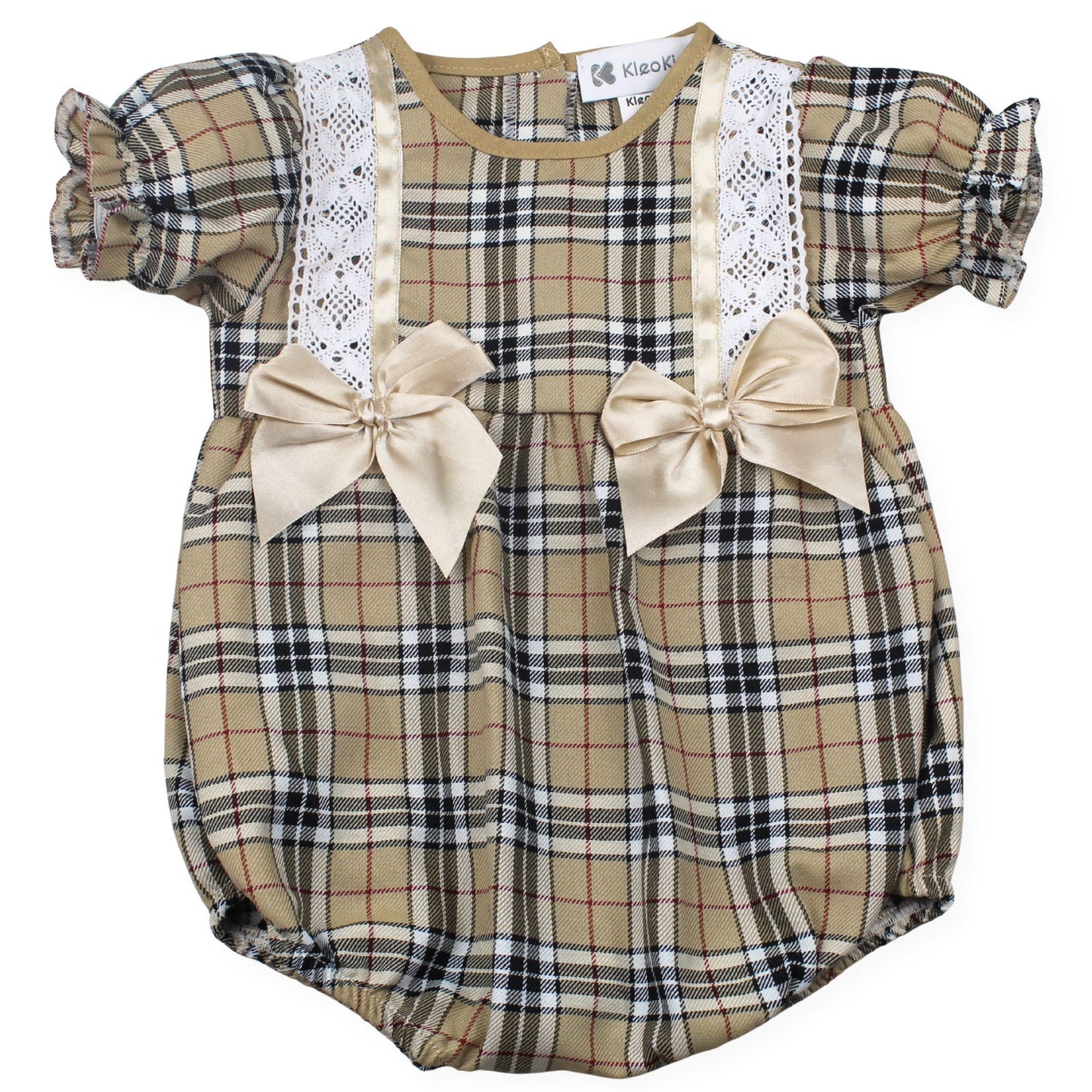 Plaid baby romper with lace details and bows on a white background