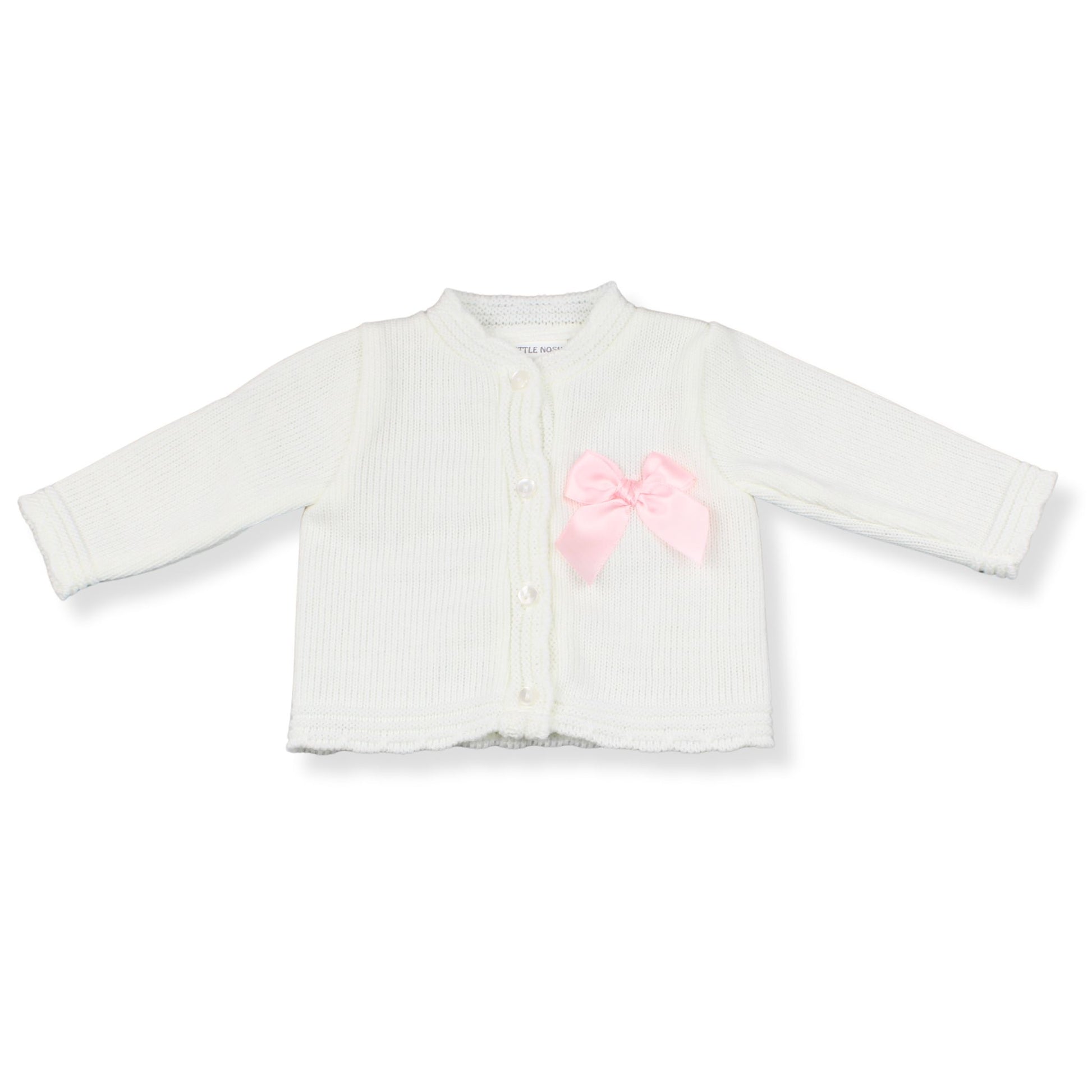 White baby cardigan with a pink bow on a white background