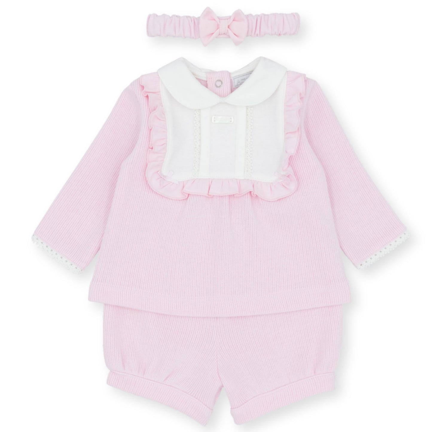 Pink baby outfit with ruffled details and matching headband on a white background