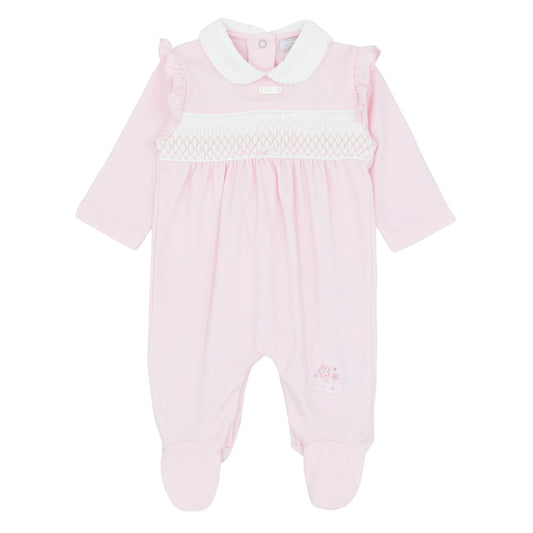 Pink baby onesie with white collar on a white background