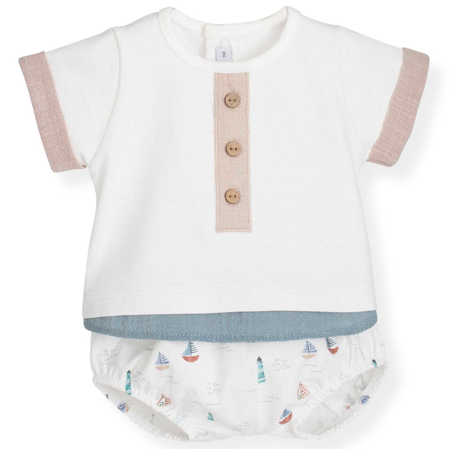 Baby outfit with white top and jam pants set featuring sailboat pattern on a white background