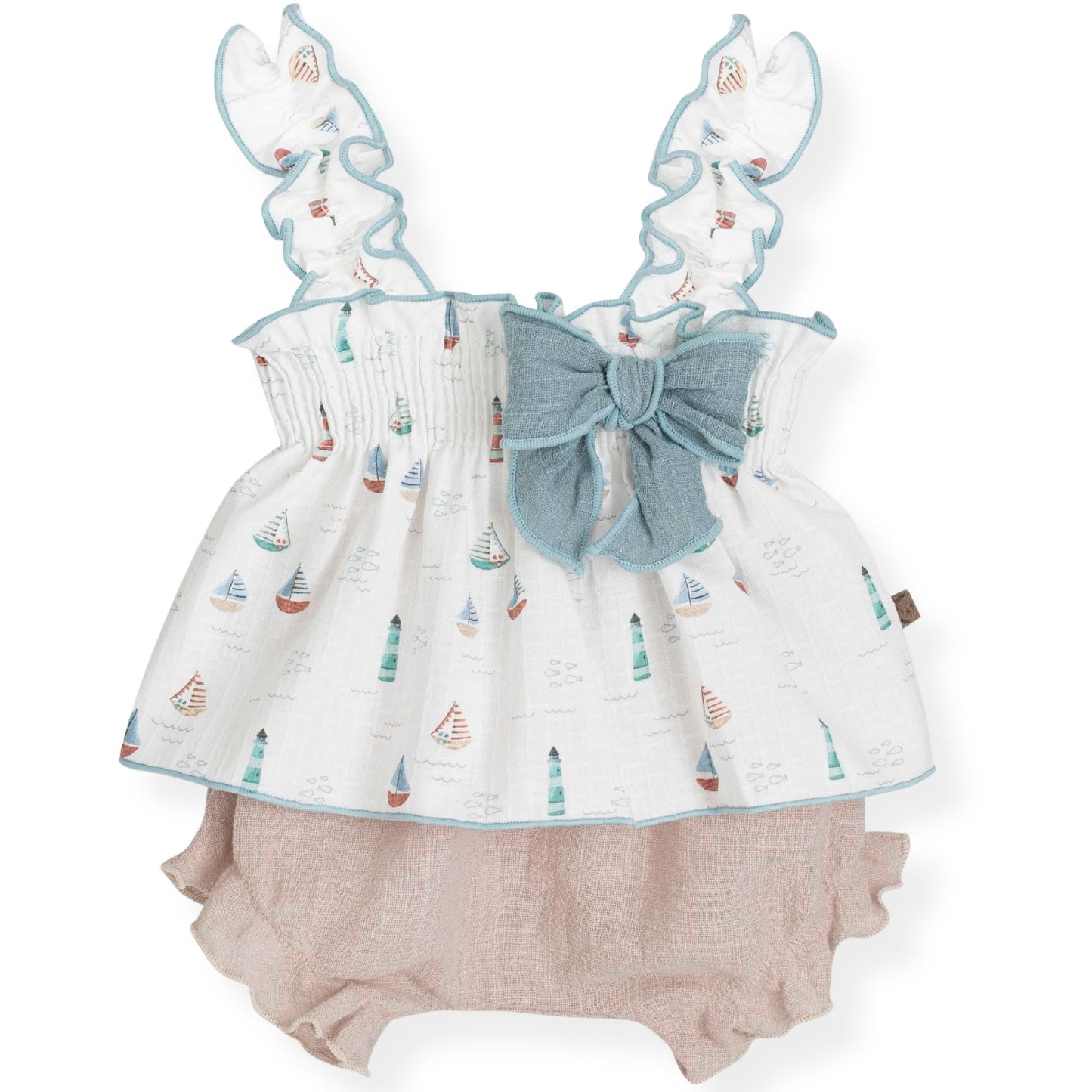 Baby outfit with sailboat patterned top and beige bloomers on a white background