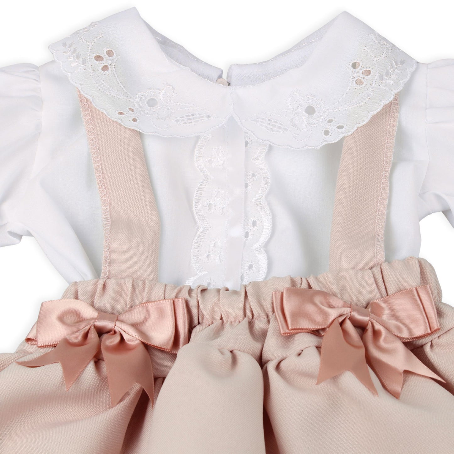 White blouse with pink ribbons and bows on a white background