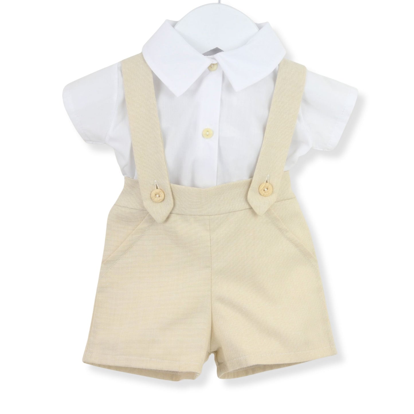 Children's outfit with beige shorts and braces on a white background