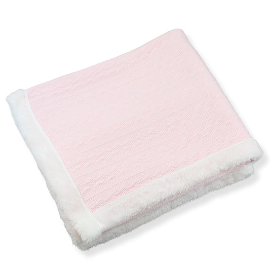 pink and white baby knitted blanket on a white background