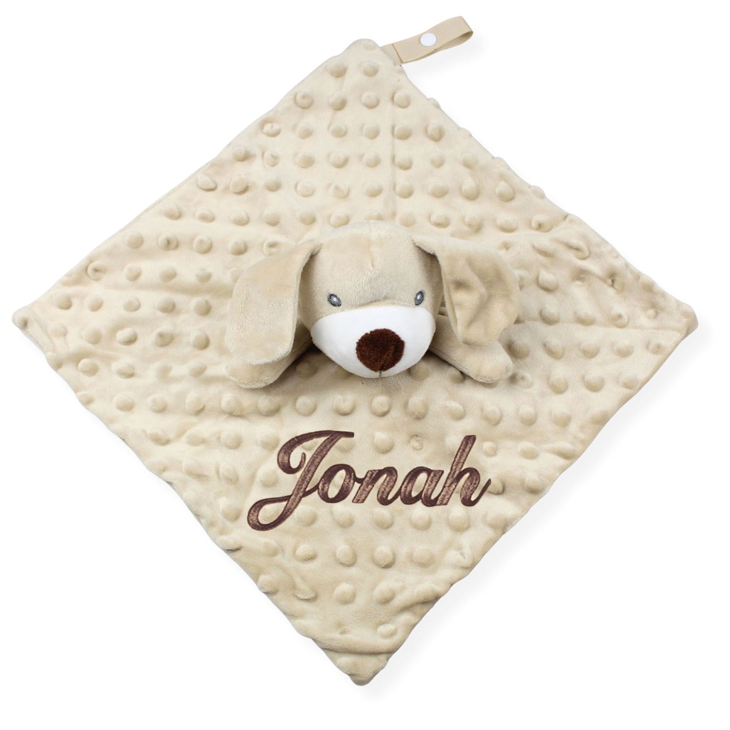 Beige plush dog toy with 'Jonah' embroidered on a white background