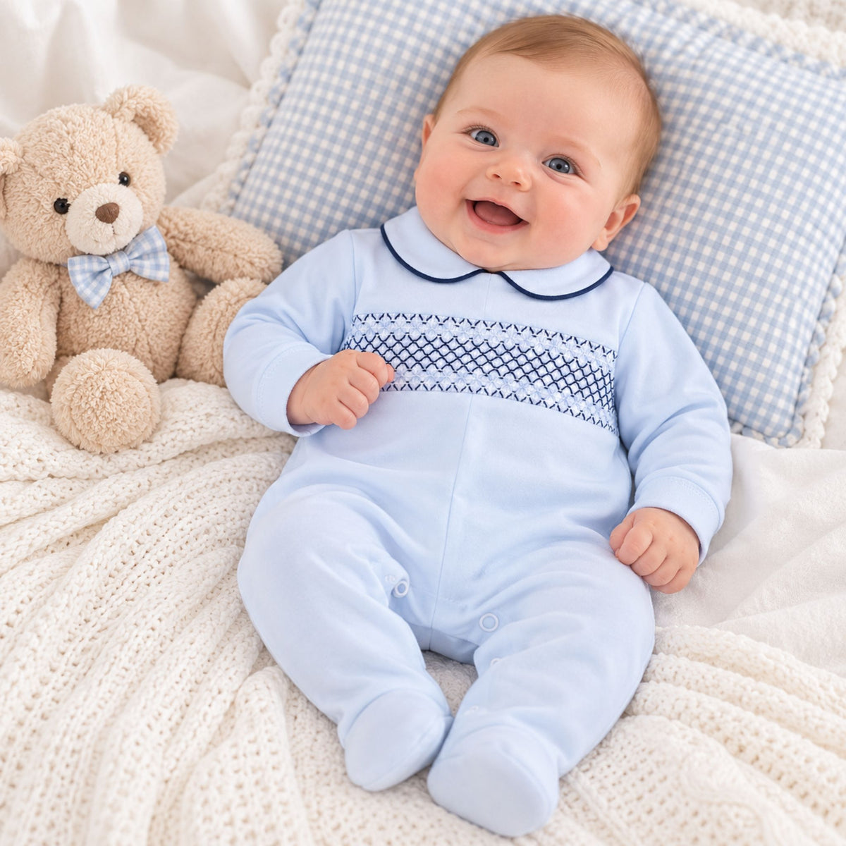 baby boy bue sleepsuit with smocking