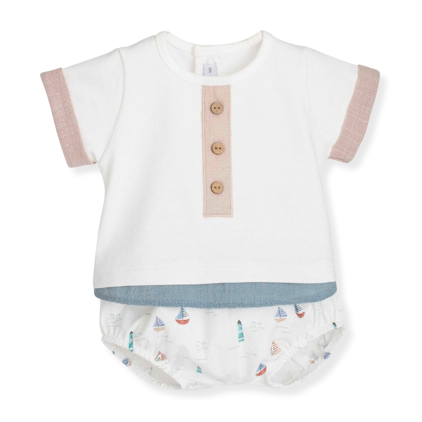 Baby outfit with white top and jam pants set featuring sailboat pattern on a white background