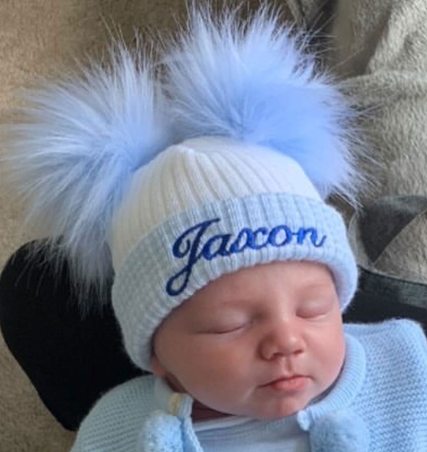 personalised baby hat with two pom poms
