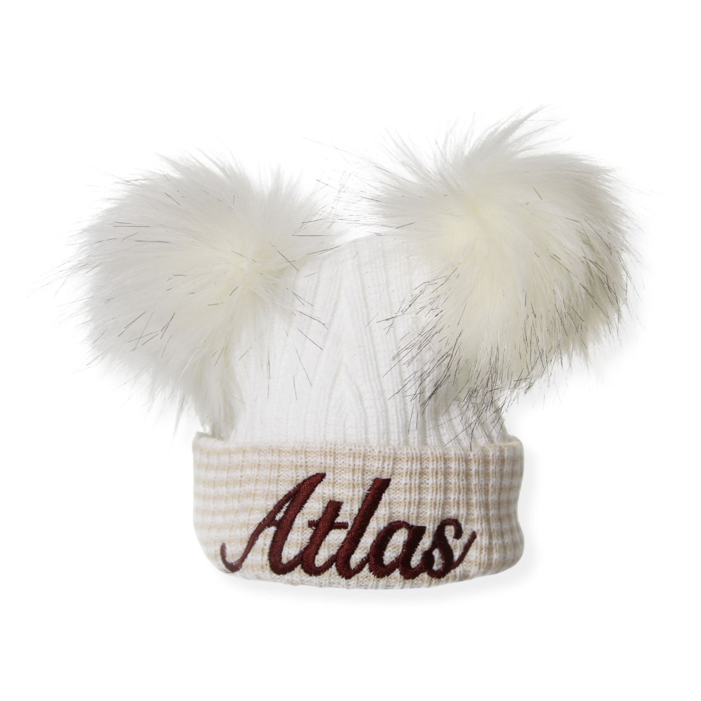 White knit beanie with two pom-poms and 'Atlas' embroidery on a white background