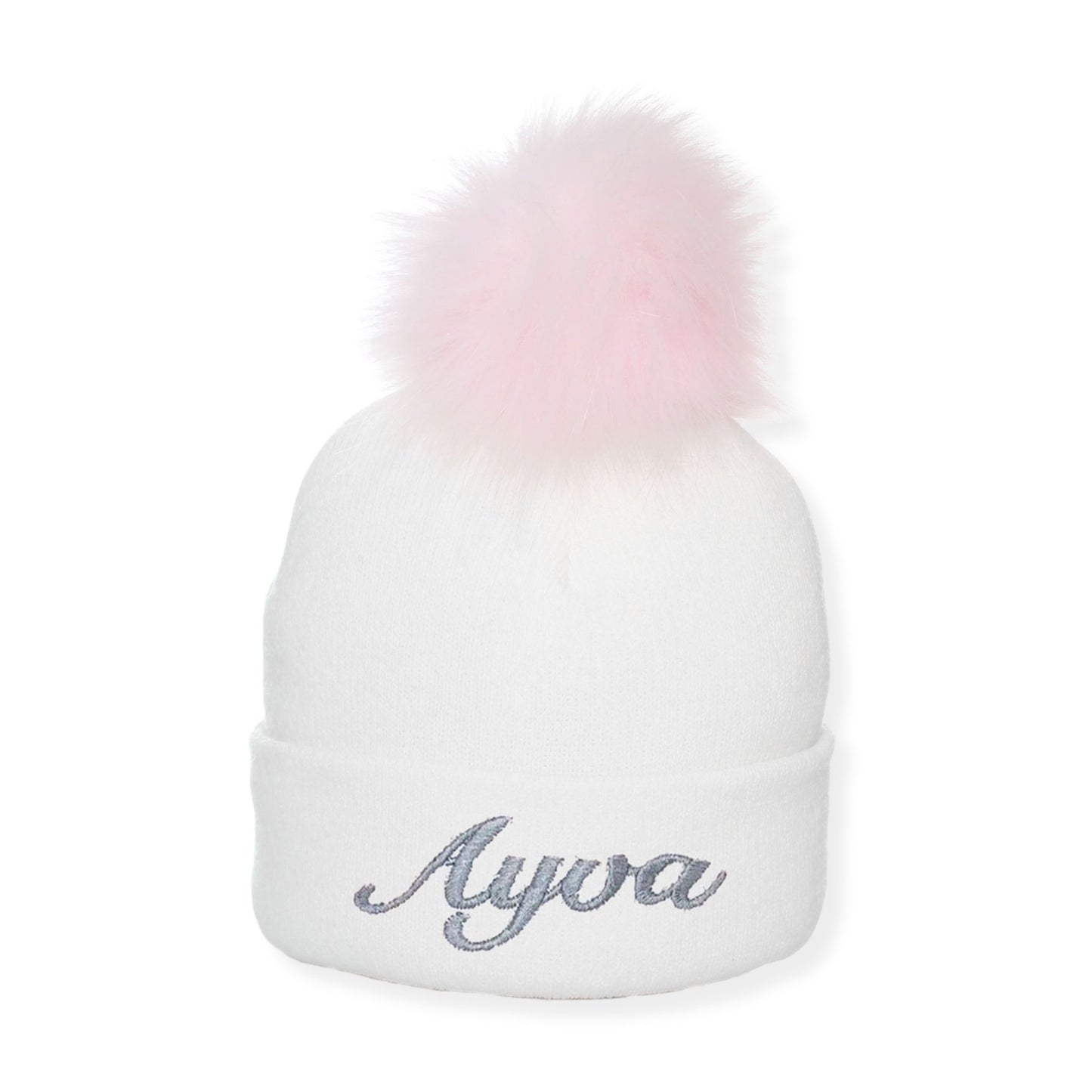 White beanie with pink pom-pom and 'Ayva' embroidery on a white background