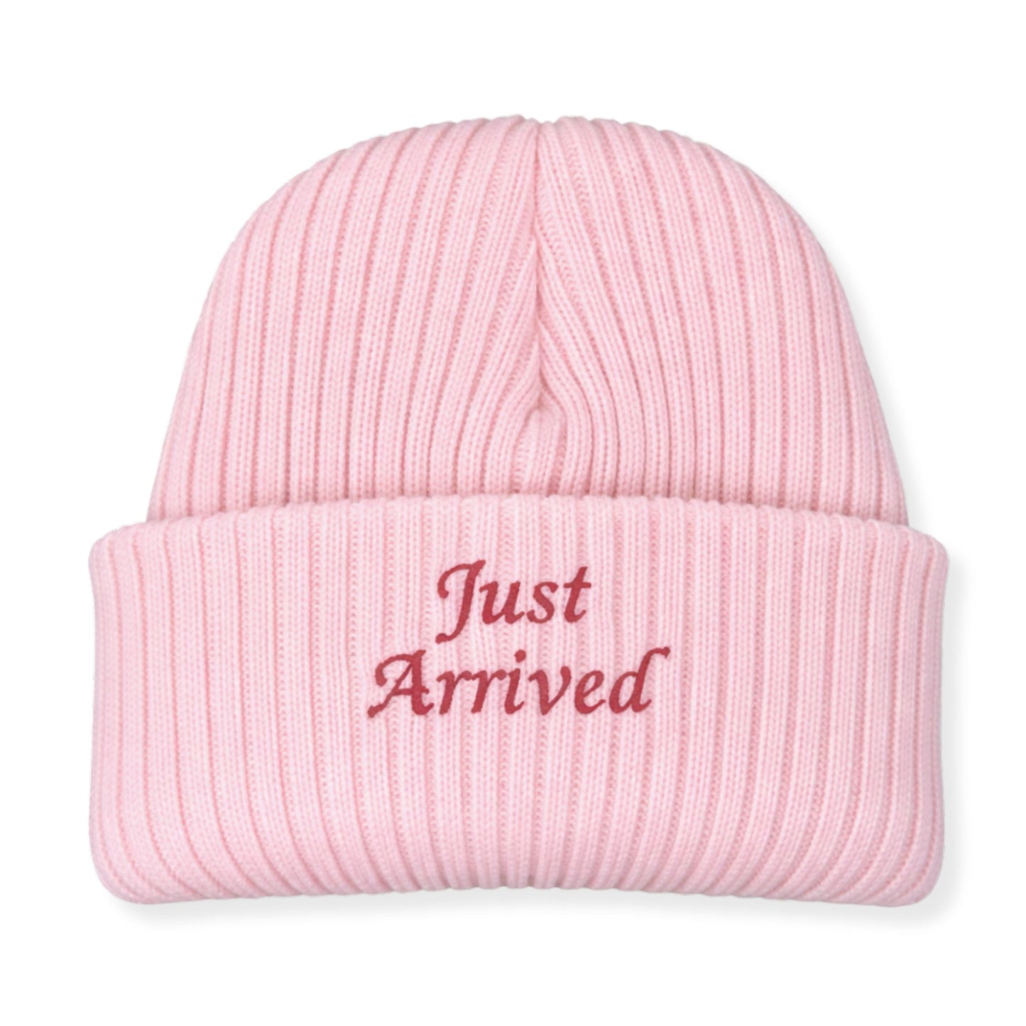 Pink beanie with 'Just Arrived' text on a white background