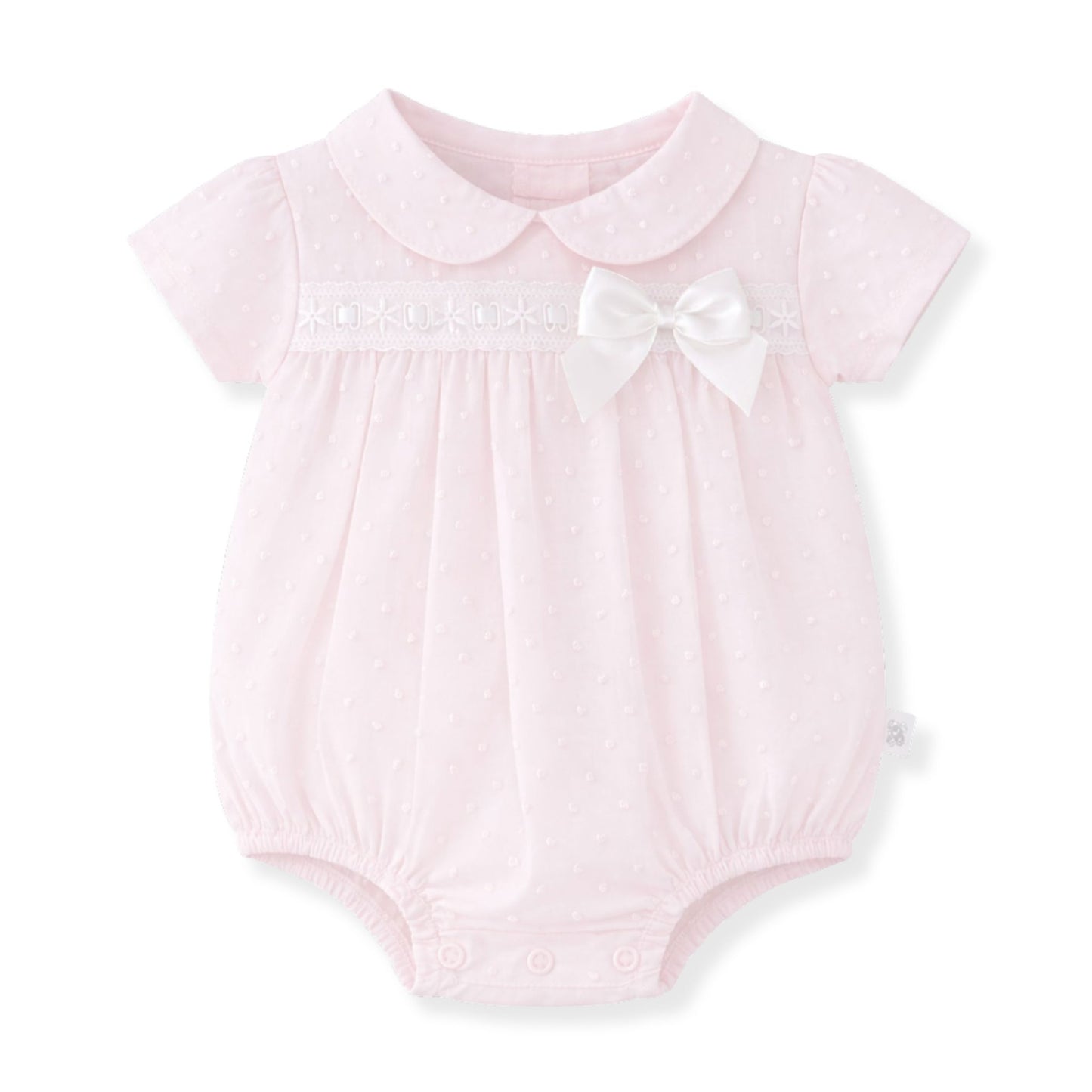 Pink baby romper with a white collar and bow on a white background