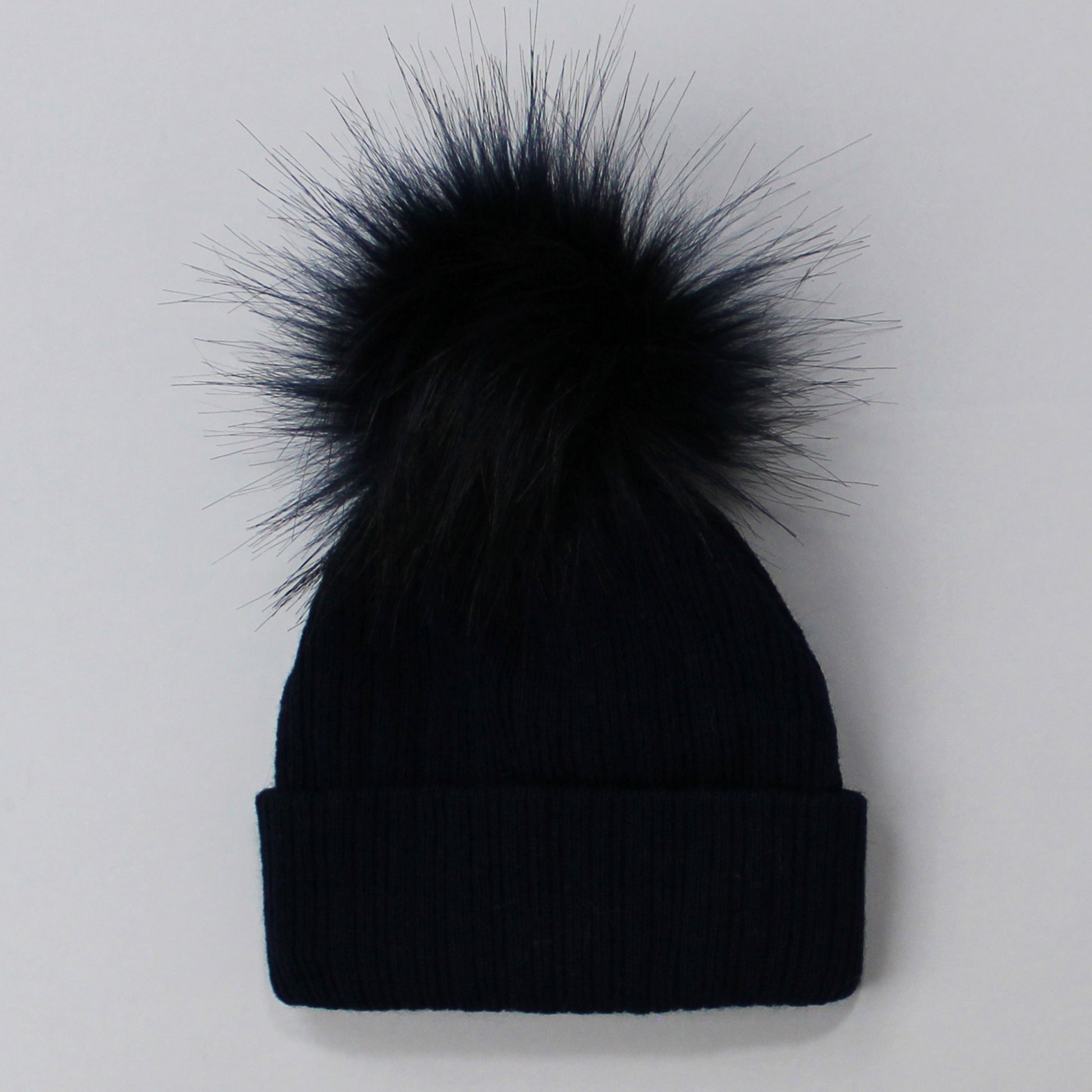 navy pom pom knitted hat