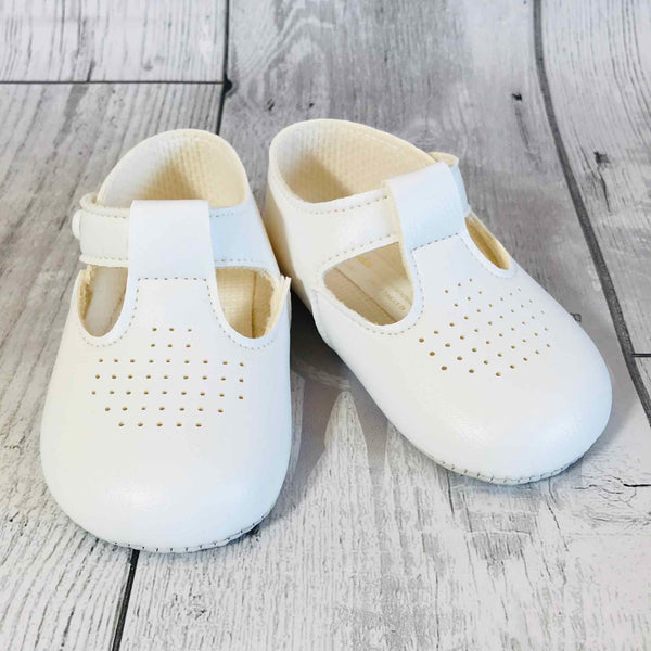 white baby shoes christening