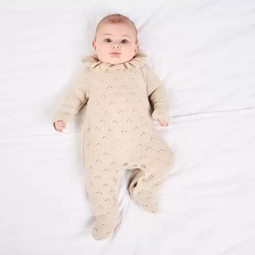 baby beige all in one knitted outfit