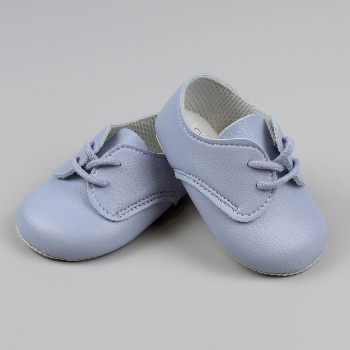blue laced up boys blue shoes