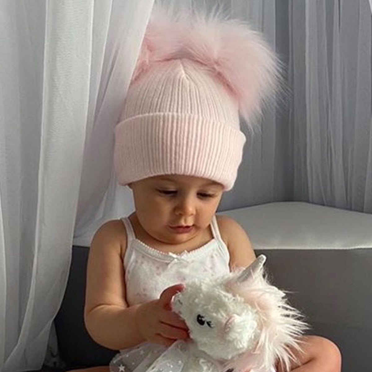 Pink double pom pom best sale hat baby