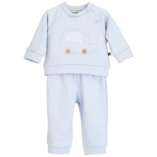 Light blue baby outfit with a matching hat on a white background
