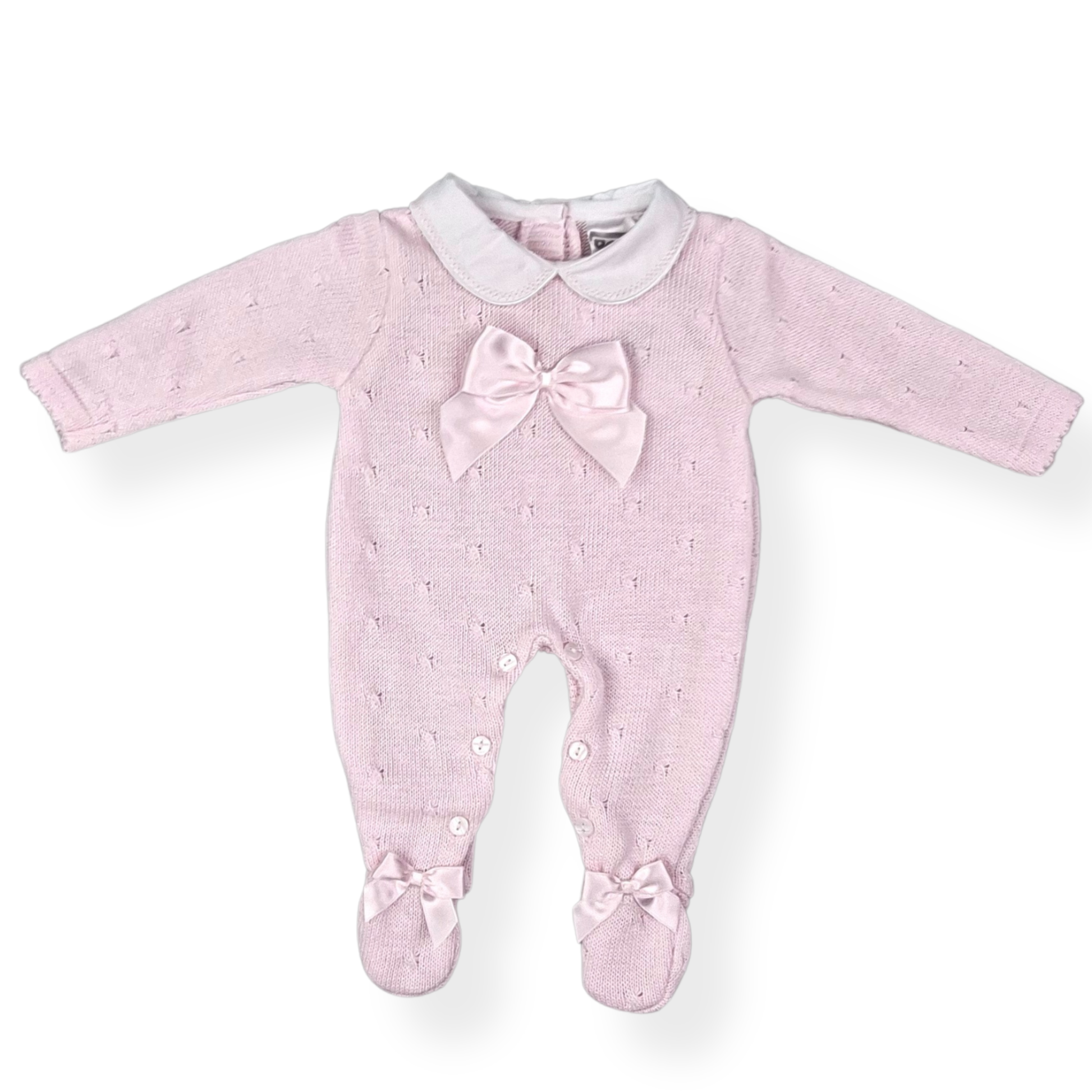 Pink baby onesie with a bow on a white background