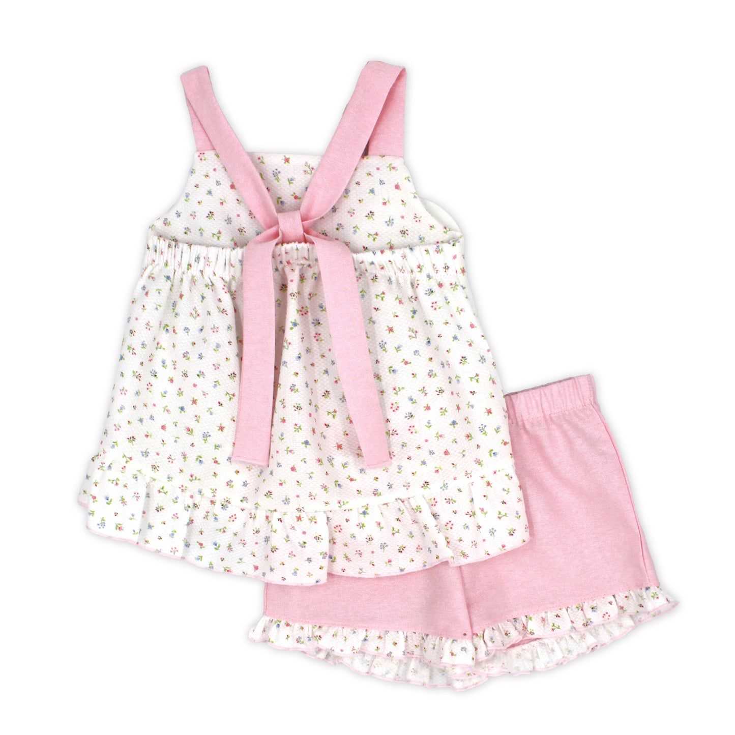 Children's dress with pink straps and ruffles on a white background