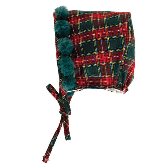 Plaid bonnet with pom-poms on a white background