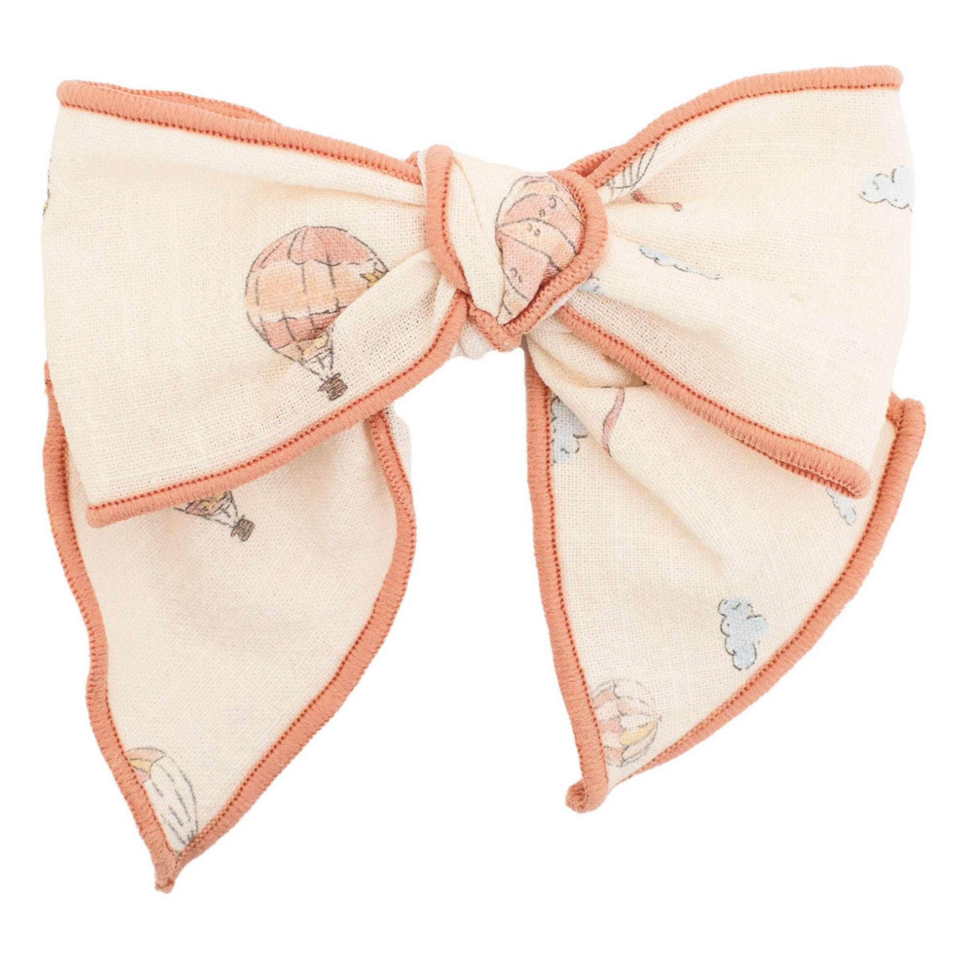 bow hairclip with hot air balloon design on a white background