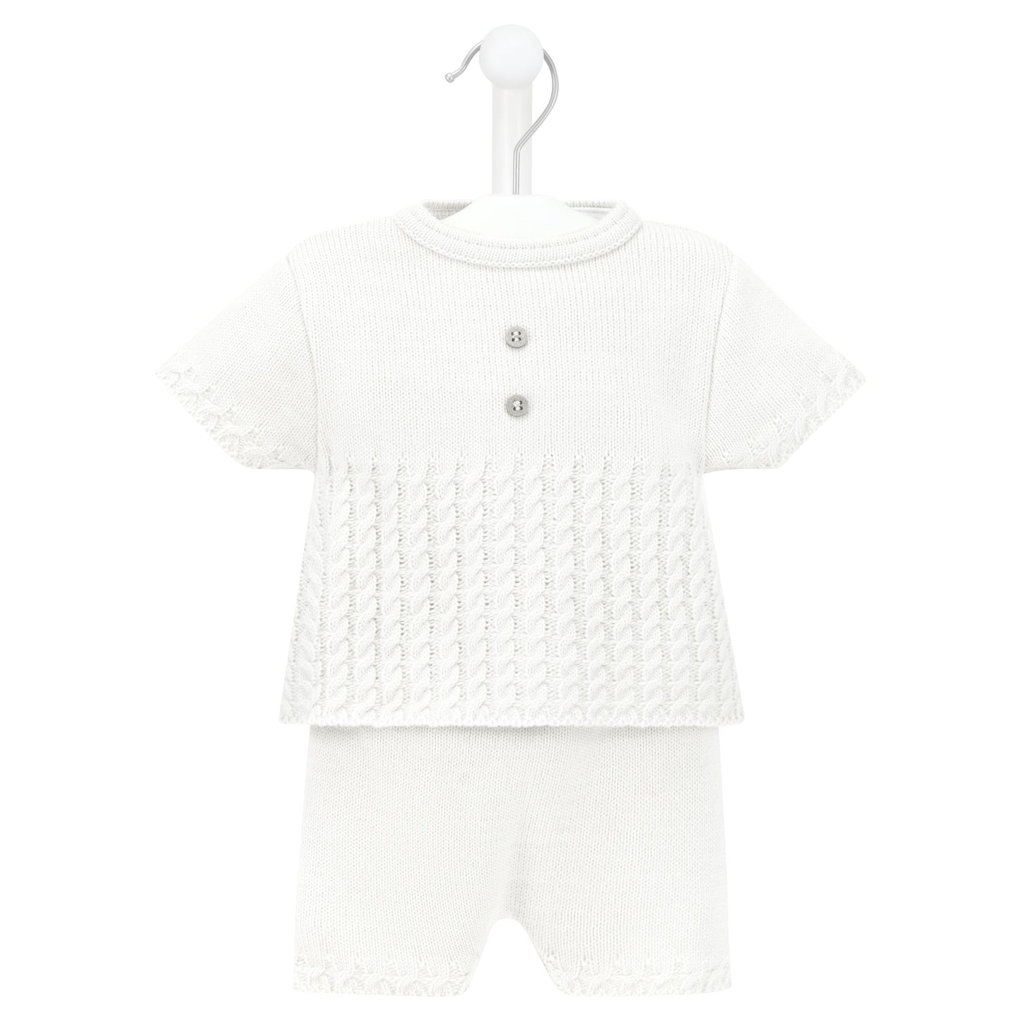 White baby outfit with a patterned top and plain pants on a white background