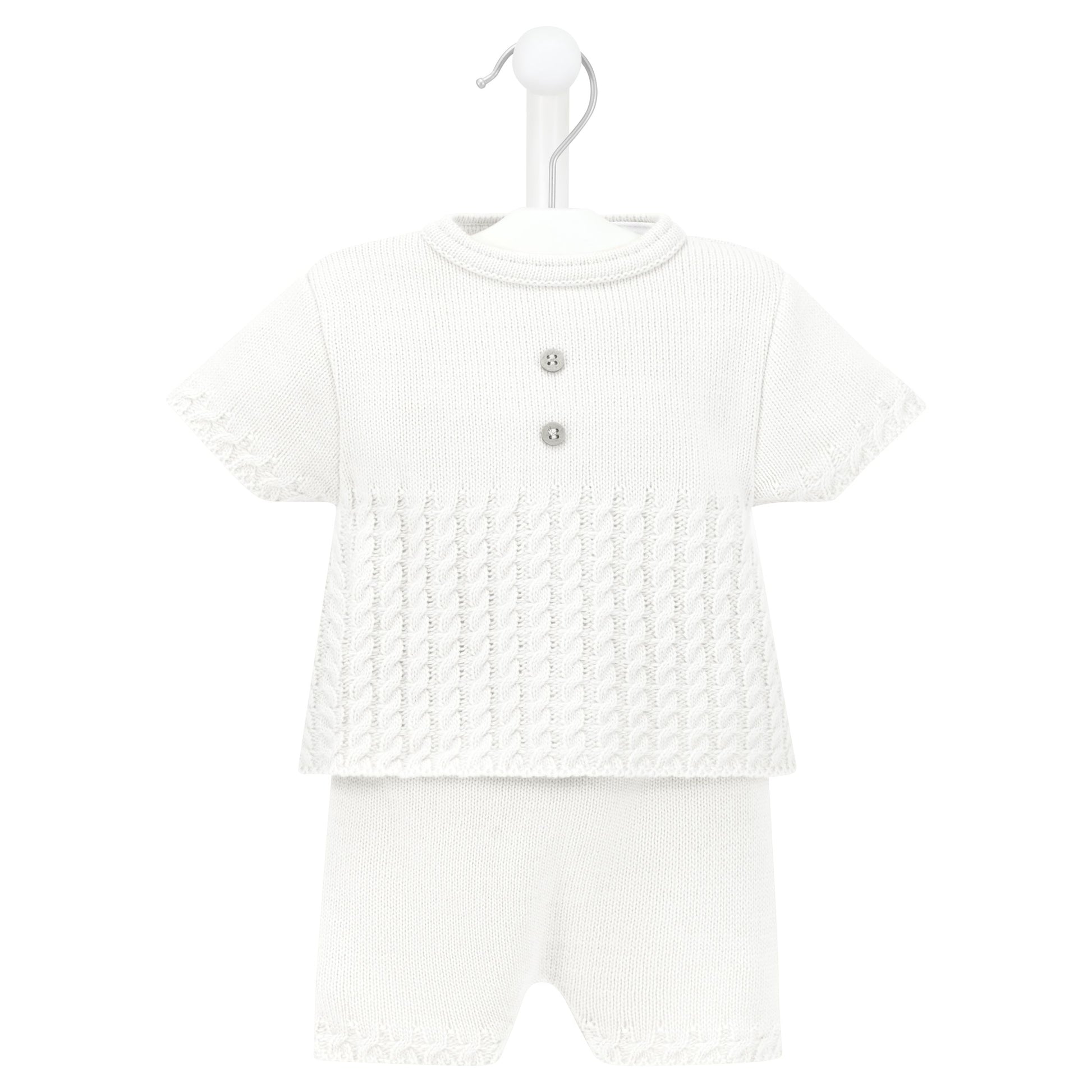 White baby outfit with a patterned top and plain pants on a white background