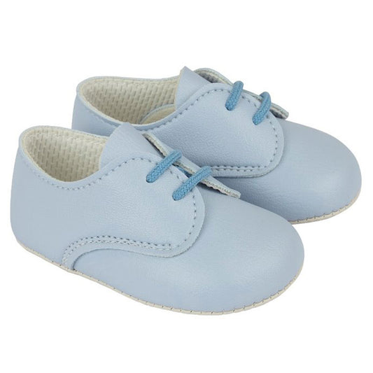 Pair of light blue baby shoes with soft soles on a white background