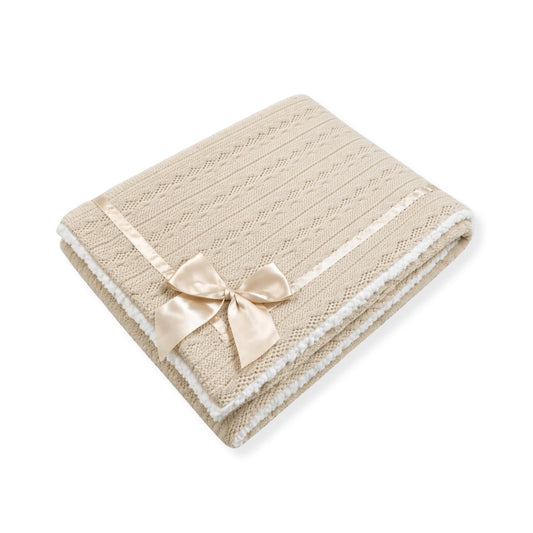 Beige textured blanket with a bow 