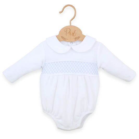 White baby romper with blue pattern on a hanger against a white background