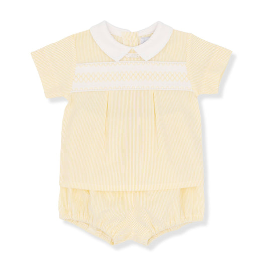 Yellow baby romper with white collar on a white background