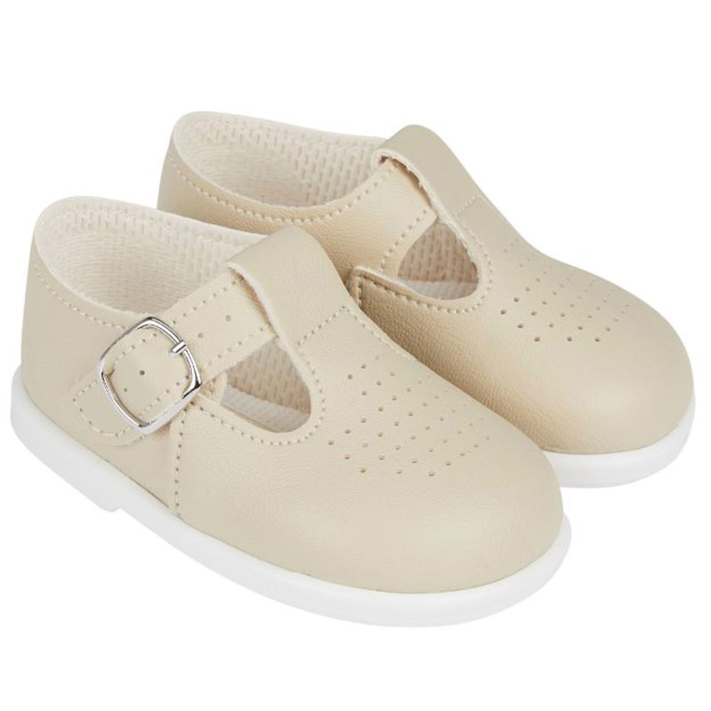 Beige children's shoes with a buckle on a white background