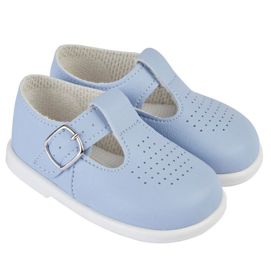 Pair of light blue children's shoes with a buckle on a white background